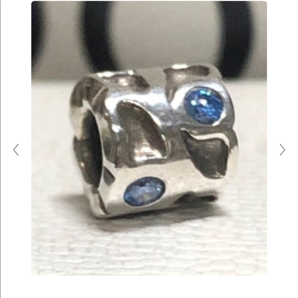 Pandora Blue Pond Charm Sterling silver. 
Recessed Pond-like areas and Blue Cz